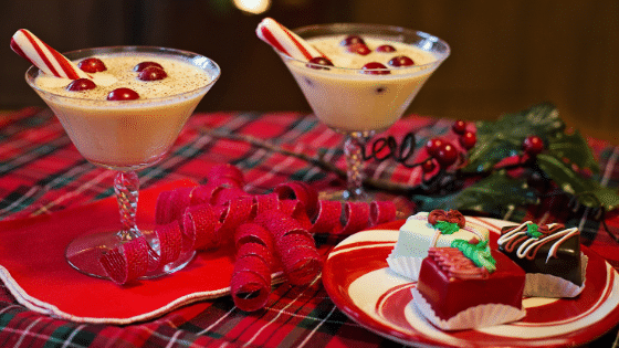A holiday spread of eggnog and small cakes