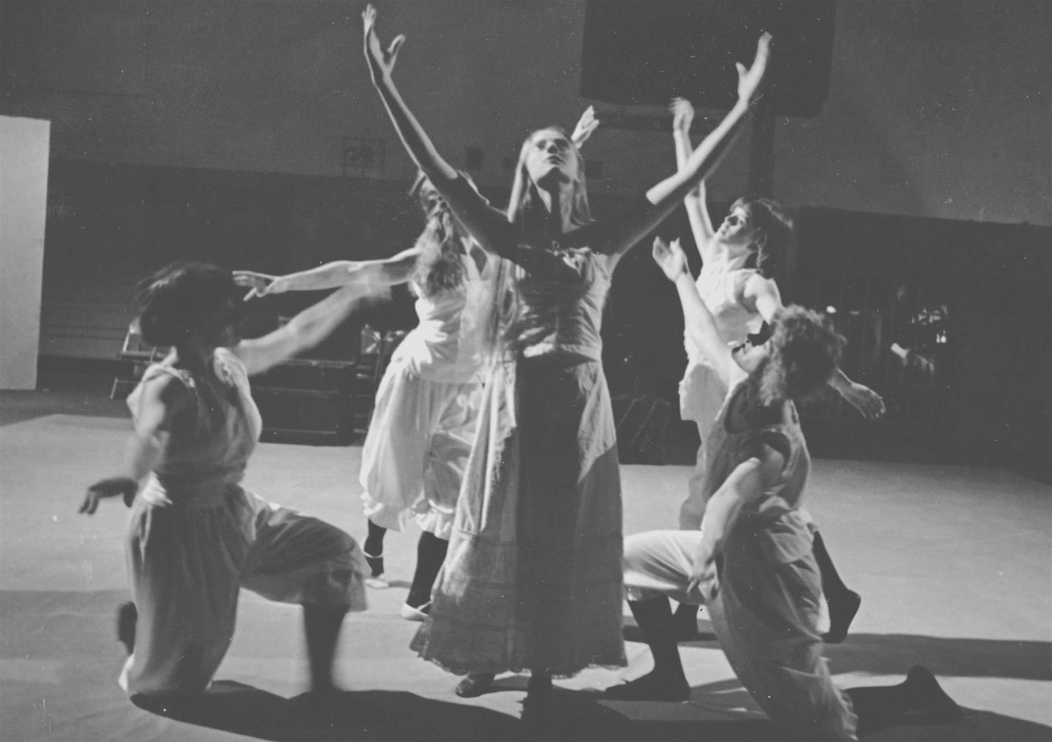 A black and white picture of dancers on stage.